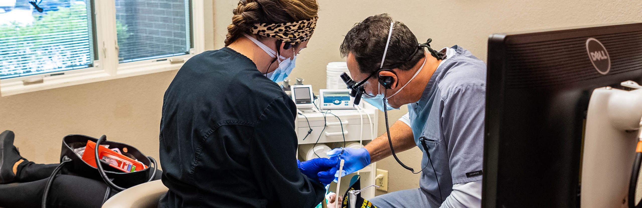 Toledo dentist Dr. Frankel staff hard at work in dental operatory.