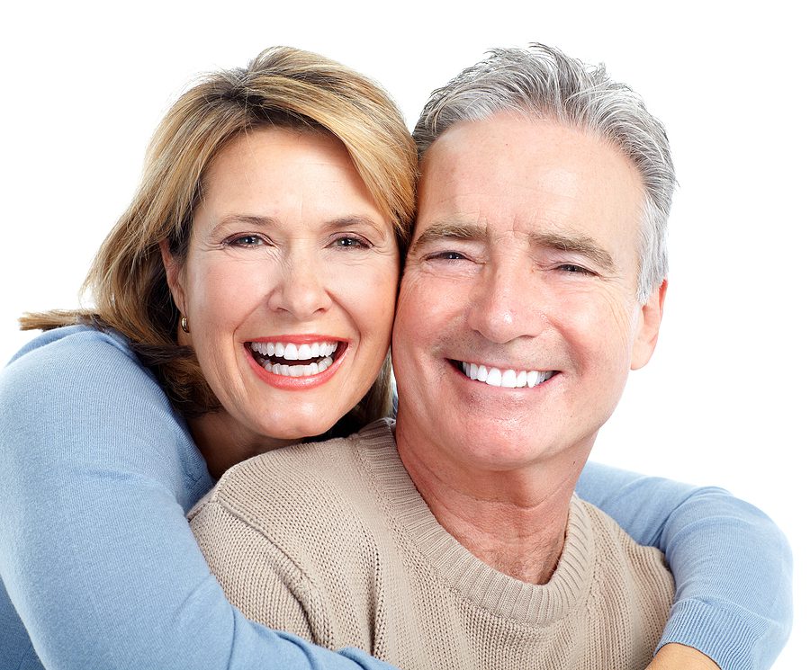 Senior smiling couple. Over white background.
